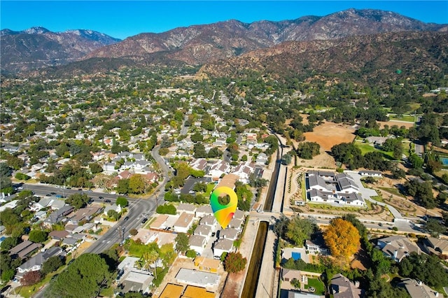 birds eye view of property with a mountain view