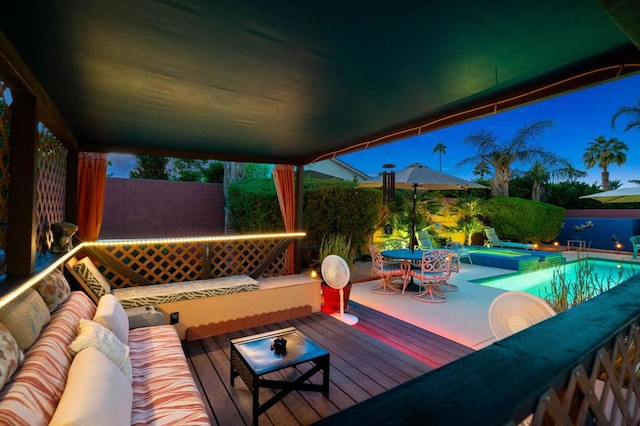 view of patio featuring outdoor lounge area and a swimming pool with hot tub