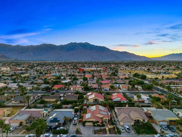 aerial view at dusk with a mountain view