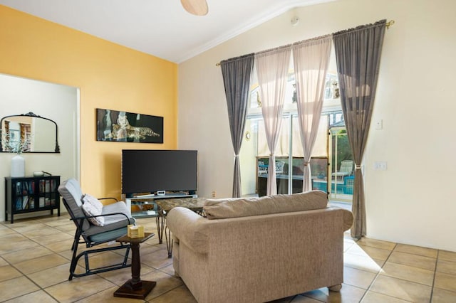 tiled living room featuring ceiling fan, ornamental molding, and vaulted ceiling