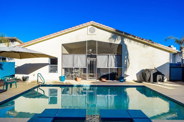 rear view of property featuring a patio