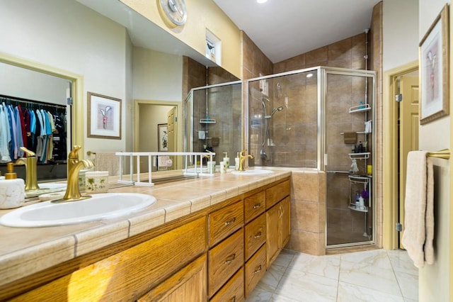 bathroom featuring vanity and a shower with shower door