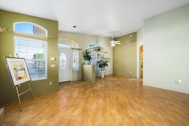 entrance foyer with ceiling fan and light hardwood / wood-style flooring