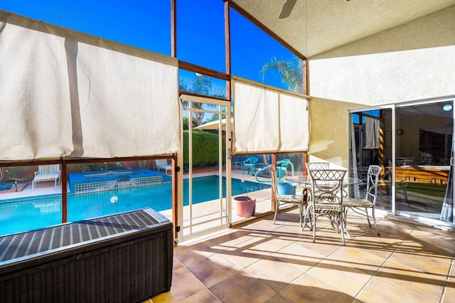 view of pool featuring a patio and ceiling fan