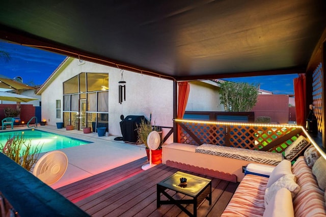 deck at dusk featuring outdoor lounge area, a fenced in pool, and a patio area