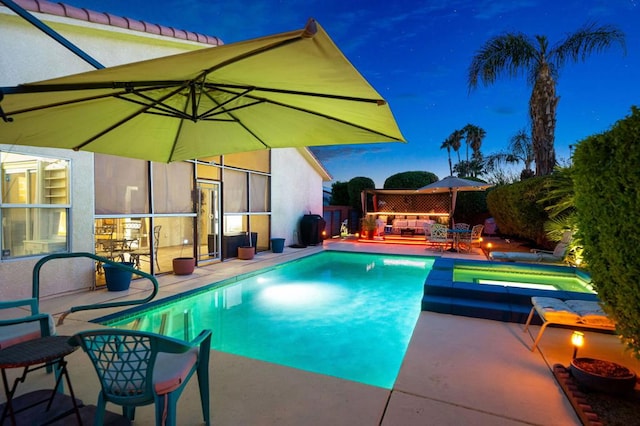 view of swimming pool featuring outdoor lounge area, an in ground hot tub, and a patio