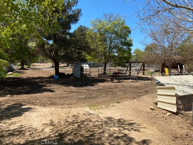 view of home's community featuring an outdoor structure