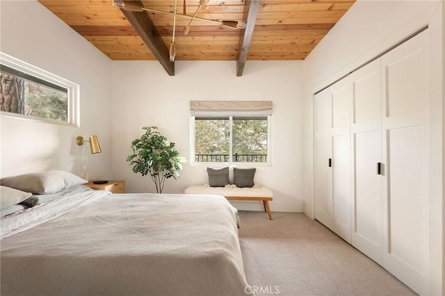 bedroom featuring light carpet, multiple windows, and wooden ceiling