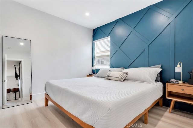 bedroom with light hardwood / wood-style flooring