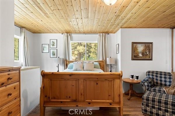 bedroom with hardwood / wood-style floors and wooden ceiling