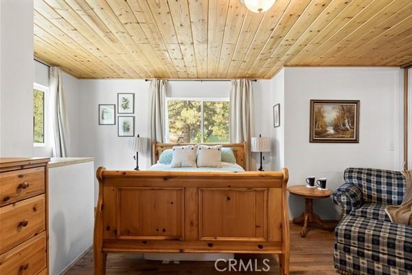 33544 Green Valley Lake Rd, Green Valley Lake, CA 92341 - bedroom featuring wooden ceiling and wood finished floors