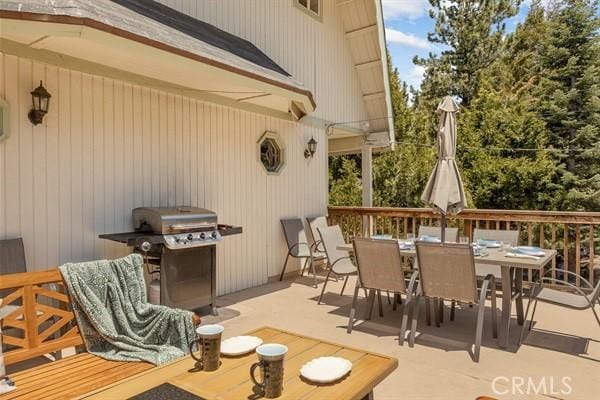 view of patio / terrace with area for grilling and a deck