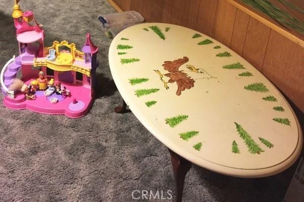 room details with carpet and wooden walls