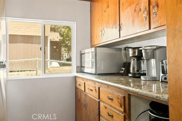 kitchen featuring light stone counters