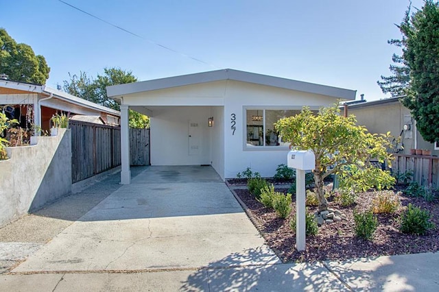 view of front of house with a carport