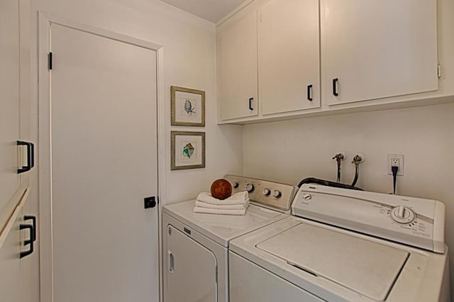 laundry area featuring cabinets and washer and dryer