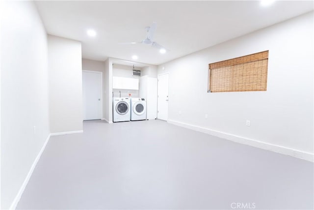 laundry room featuring separate washer and dryer and ceiling fan