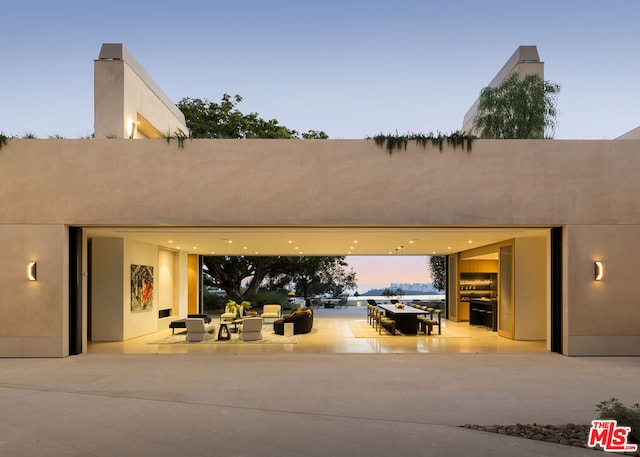 view of patio terrace at dusk