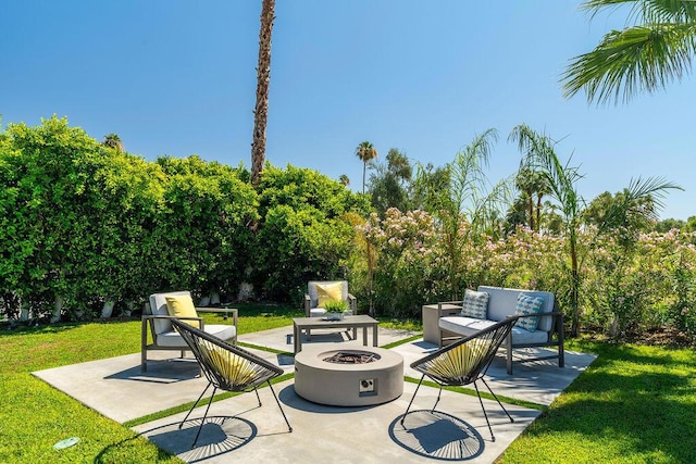 view of patio featuring an outdoor living space with a fire pit