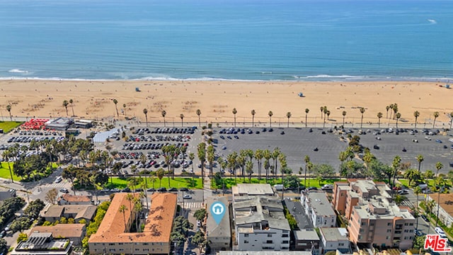 bird's eye view with a beach view and a water view