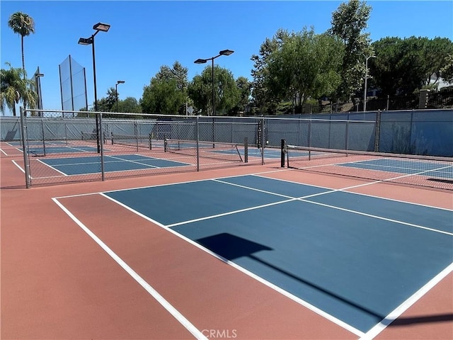 view of tennis court featuring basketball court