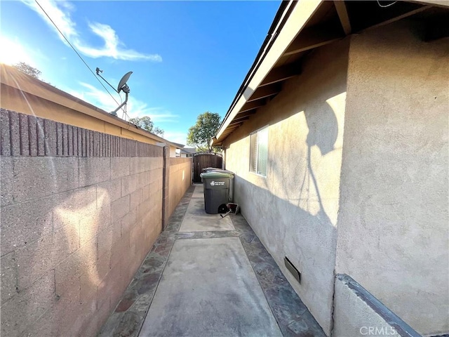 view of property exterior featuring a patio area