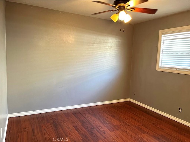 empty room featuring hardwood / wood-style flooring and ceiling fan