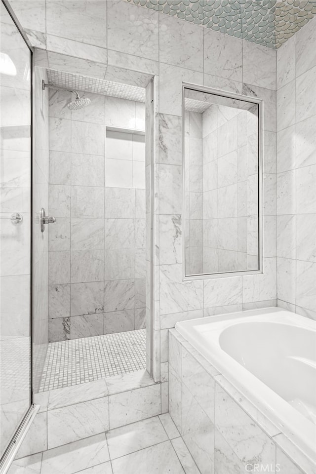 bathroom with plus walk in shower and tile walls