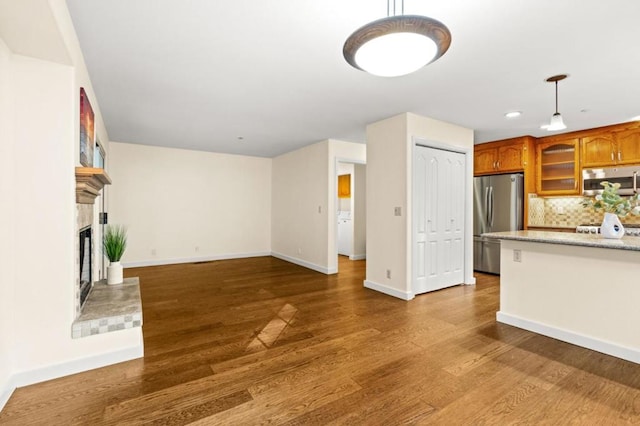 unfurnished living room featuring dark hardwood / wood-style floors