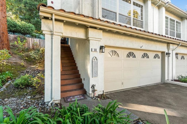 view of side of property featuring a garage