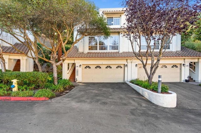 mediterranean / spanish-style home featuring a garage