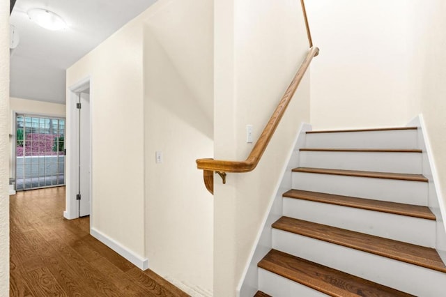 stairway featuring hardwood / wood-style floors