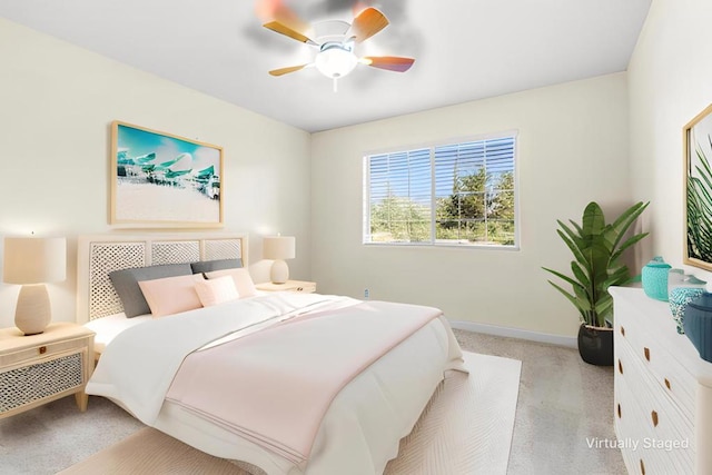 bedroom featuring light colored carpet and ceiling fan