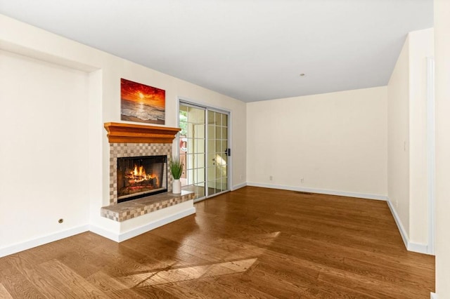 unfurnished living room with hardwood / wood-style floors