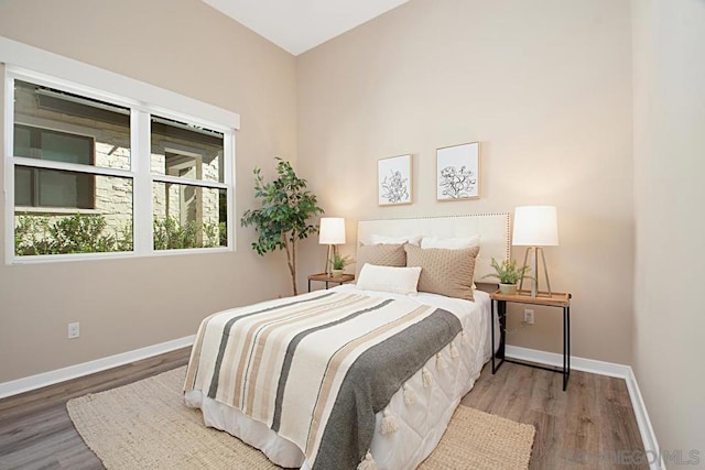 bedroom with hardwood / wood-style floors