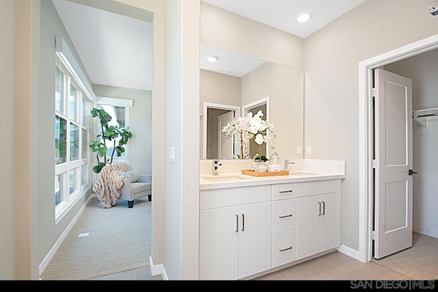 bathroom with tile patterned floors and vanity