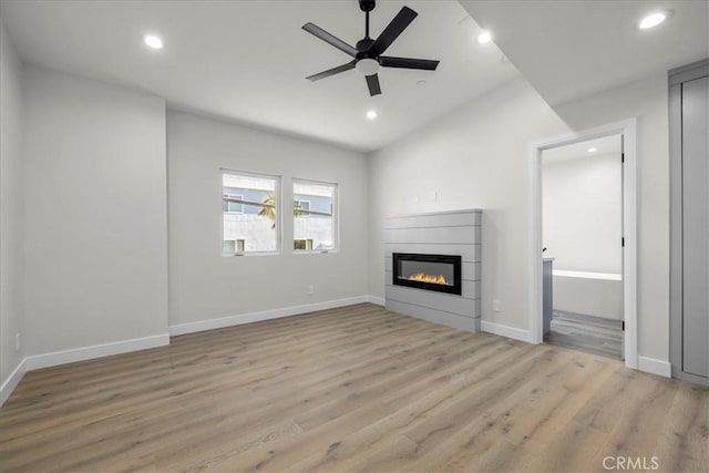 unfurnished living room featuring light hardwood / wood-style floors and ceiling fan