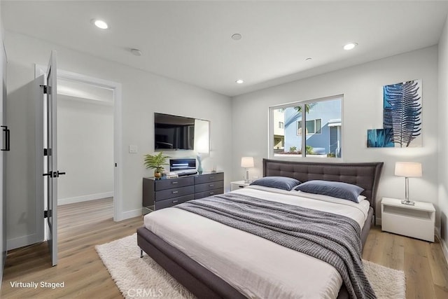 bedroom featuring light hardwood / wood-style floors