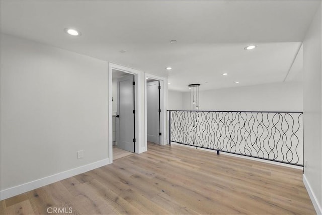 empty room with light hardwood / wood-style flooring