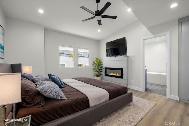 bedroom featuring ceiling fan and light hardwood / wood-style flooring