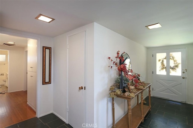 interior space with dark hardwood / wood-style flooring