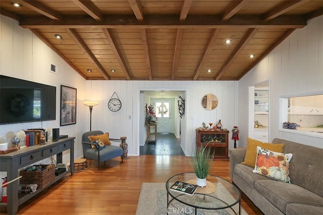 living room featuring vaulted ceiling with beams, wooden walls, wooden ceiling, and light wood-type flooring