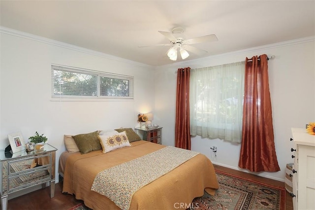 bedroom featuring ceiling fan, dark hardwood / wood-style floors, and ornamental molding