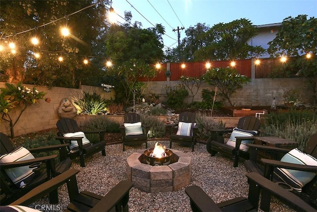 patio terrace at dusk with an outdoor fire pit