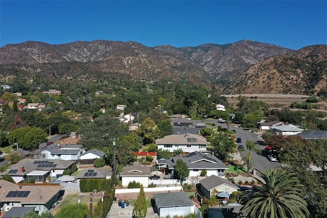 birds eye view of property with a mountain view