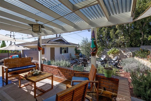 view of patio featuring an outdoor living space and a pergola