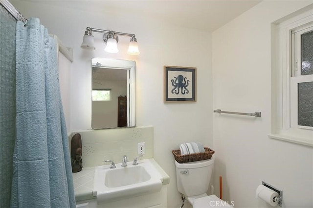 bathroom with toilet and sink