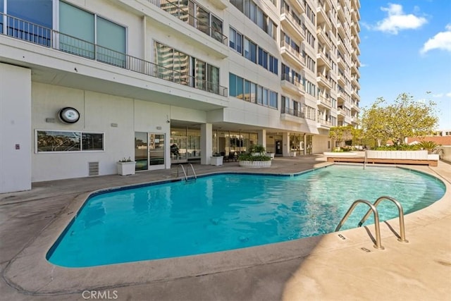 view of swimming pool with a patio