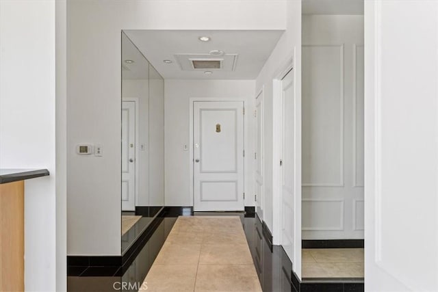 hallway with light tile patterned flooring