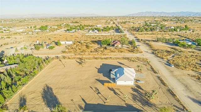 drone / aerial view featuring a mountain view